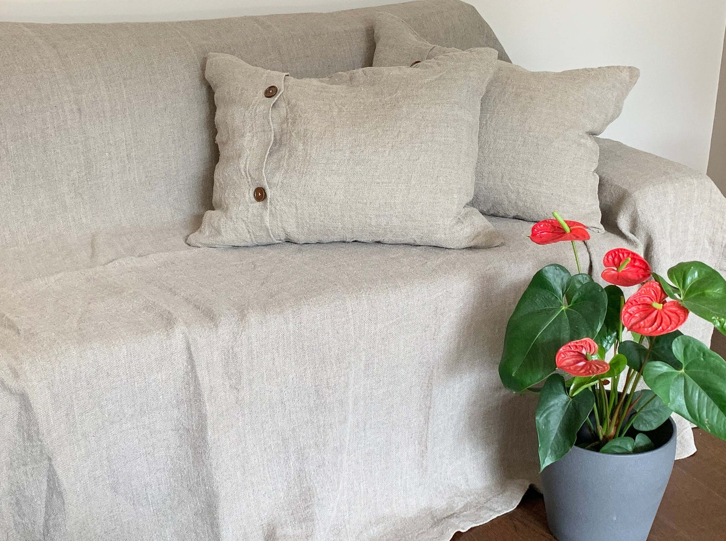 Detail of rustic wooden buttons on linen pillowcase