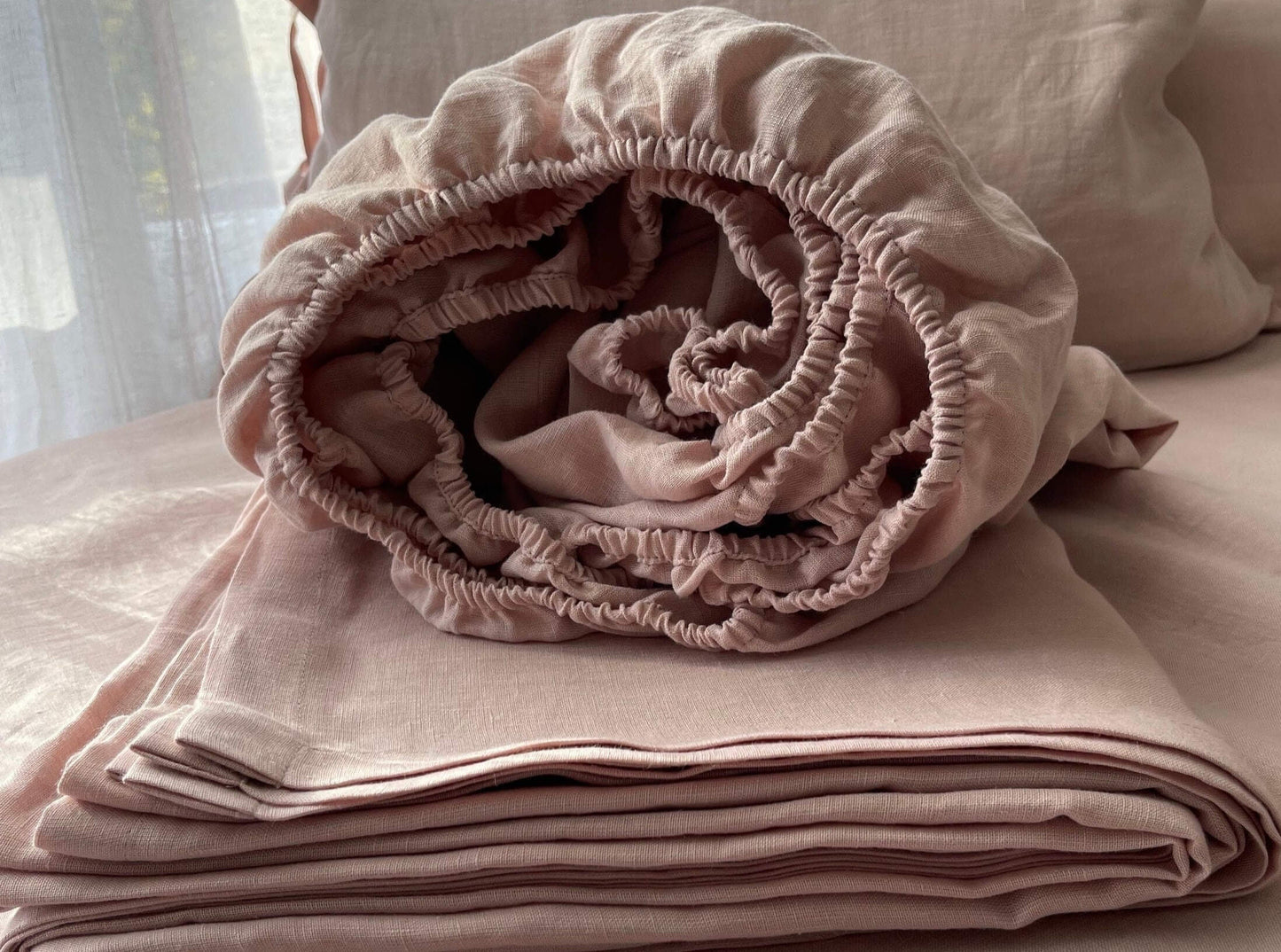 Dusty rose linen bedding closeup