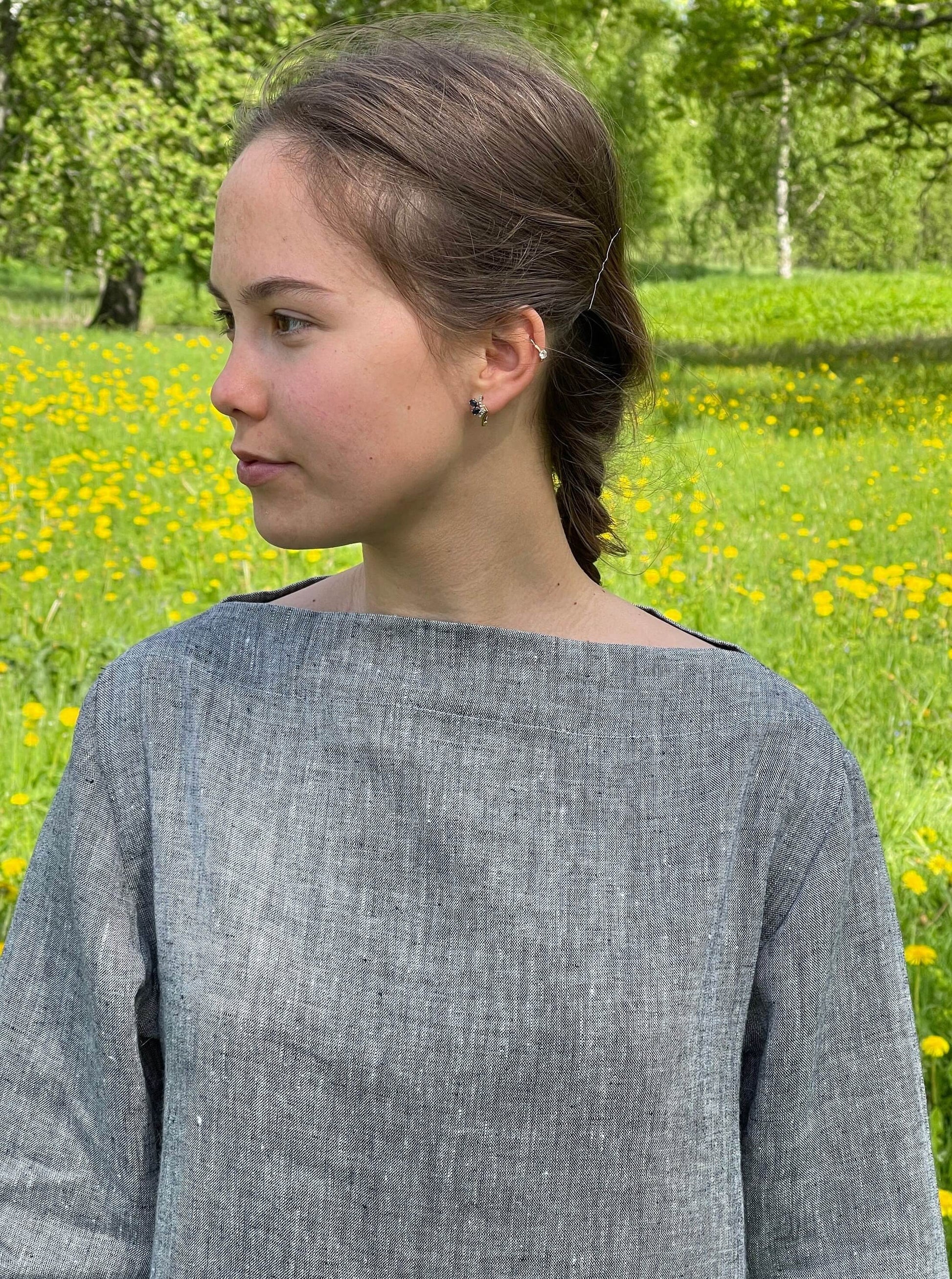Chic linen dress with side pockets, showcasing craftsmanship and comfort.