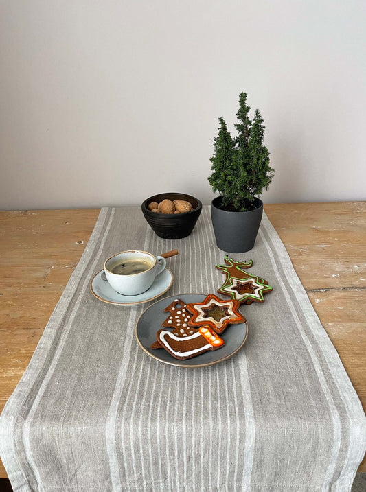Elegant beige linen table runner on dining table