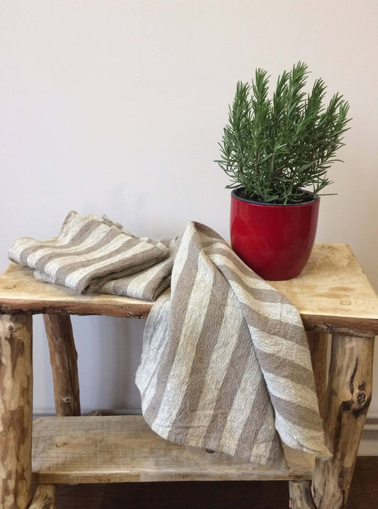Beige stripe linen kitchen towel on counter