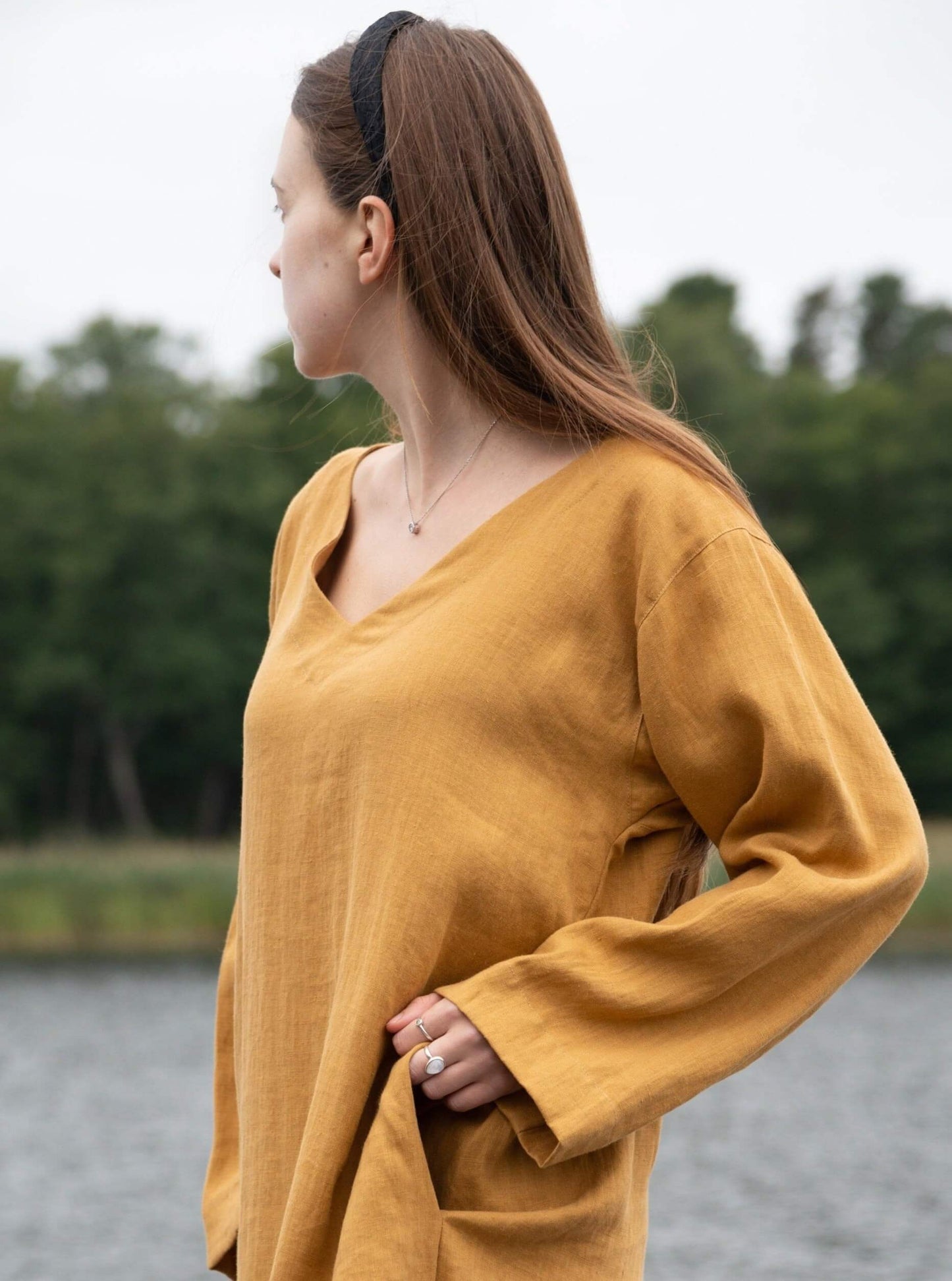 Detailed view of linen tunic dress fabric and stitching