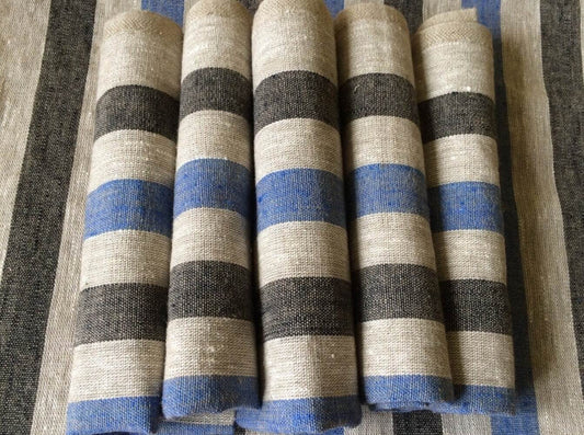 Blue and gray striped linen placemats on table