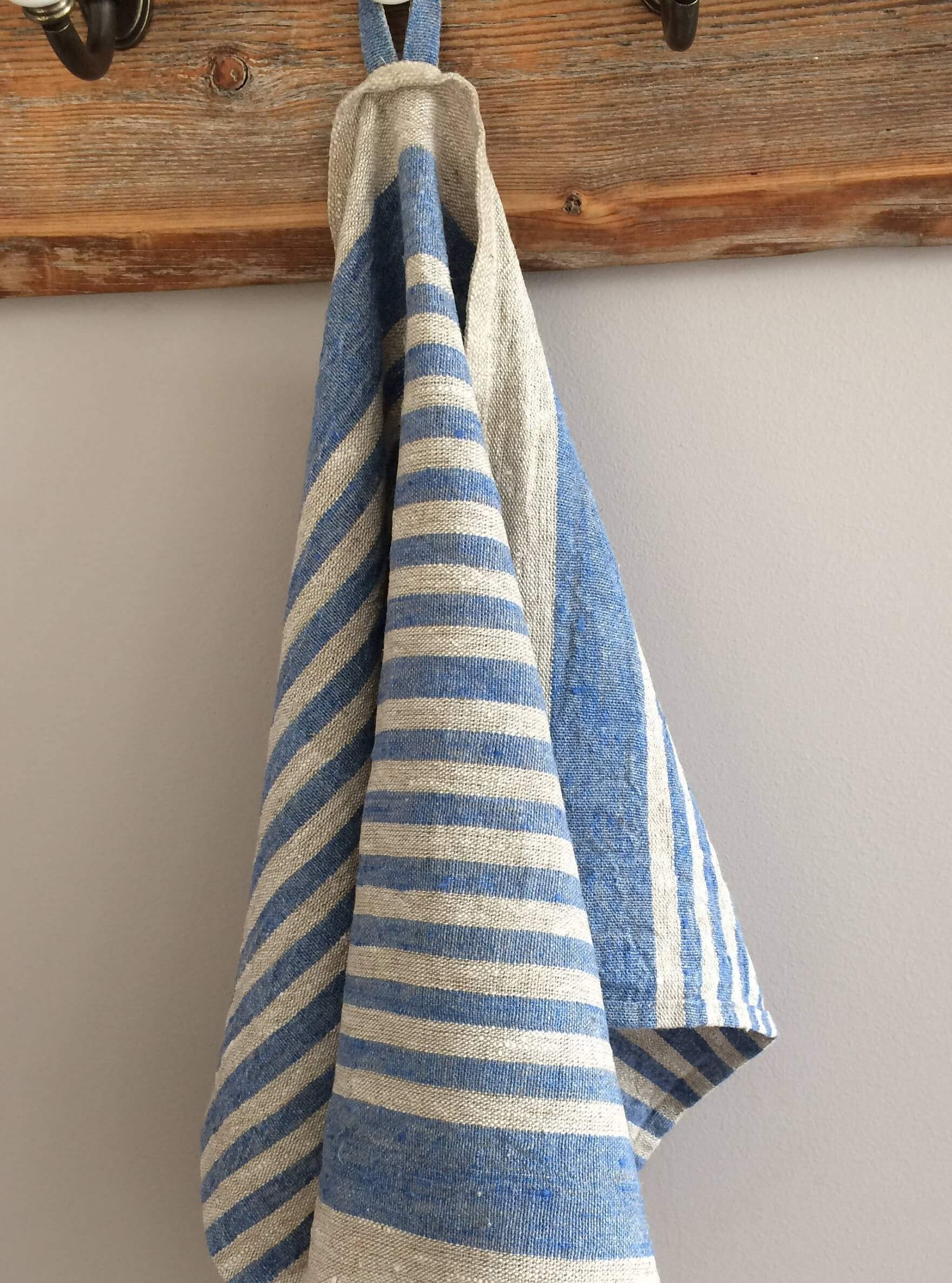 Handcrafted linen towel with sky blue and beige stripes