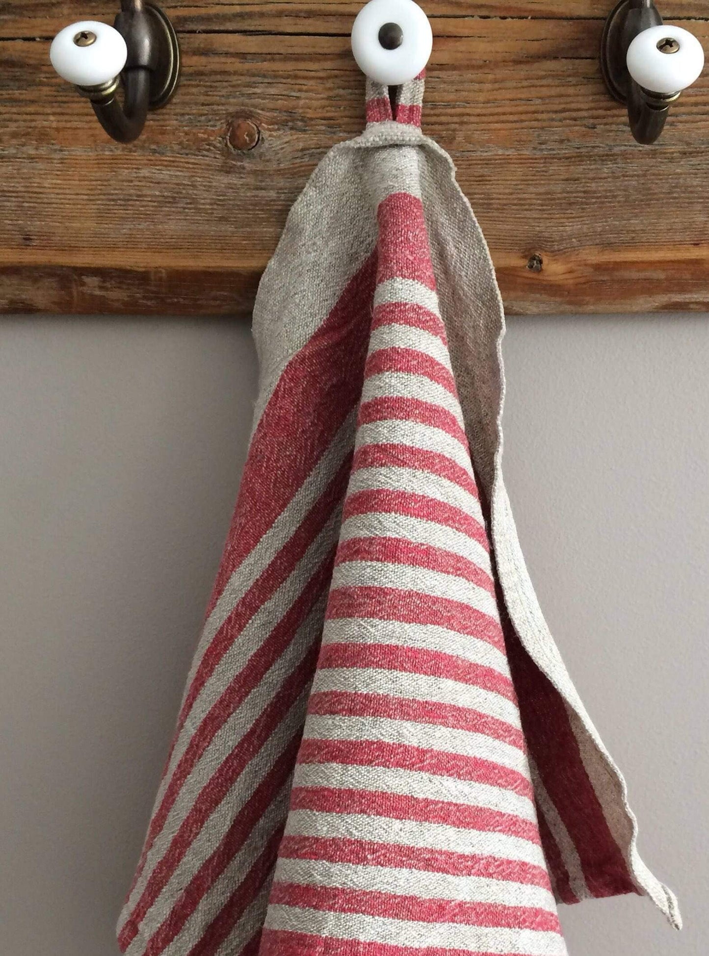 Striped handmade tea towel in poppy red