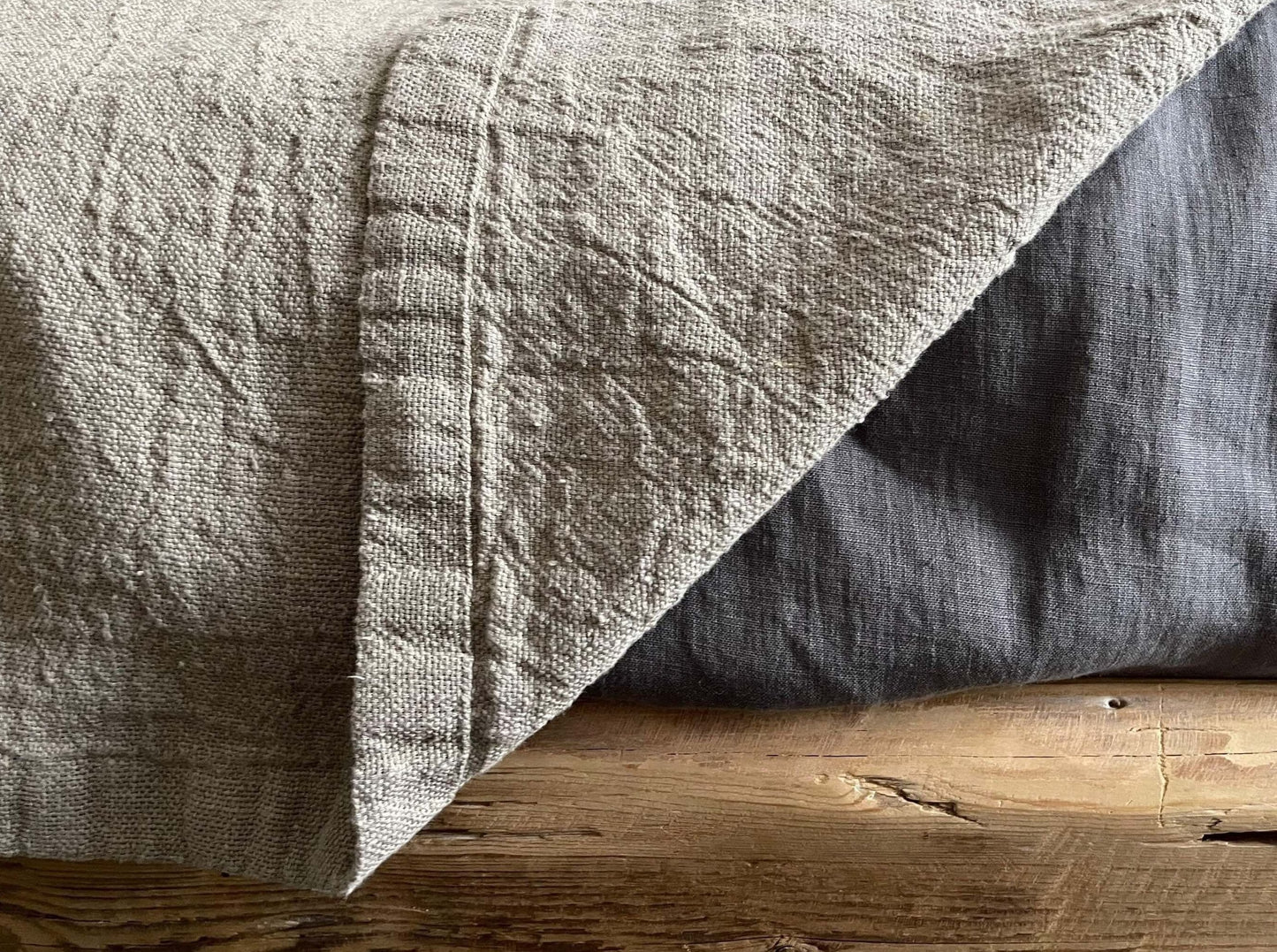Detail of the finished edges on the Rustic Natural Linen Blanket, demonstrating its craftsmanship.